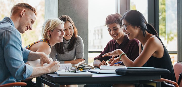 college-students-studying-personal-finance-together-718x344